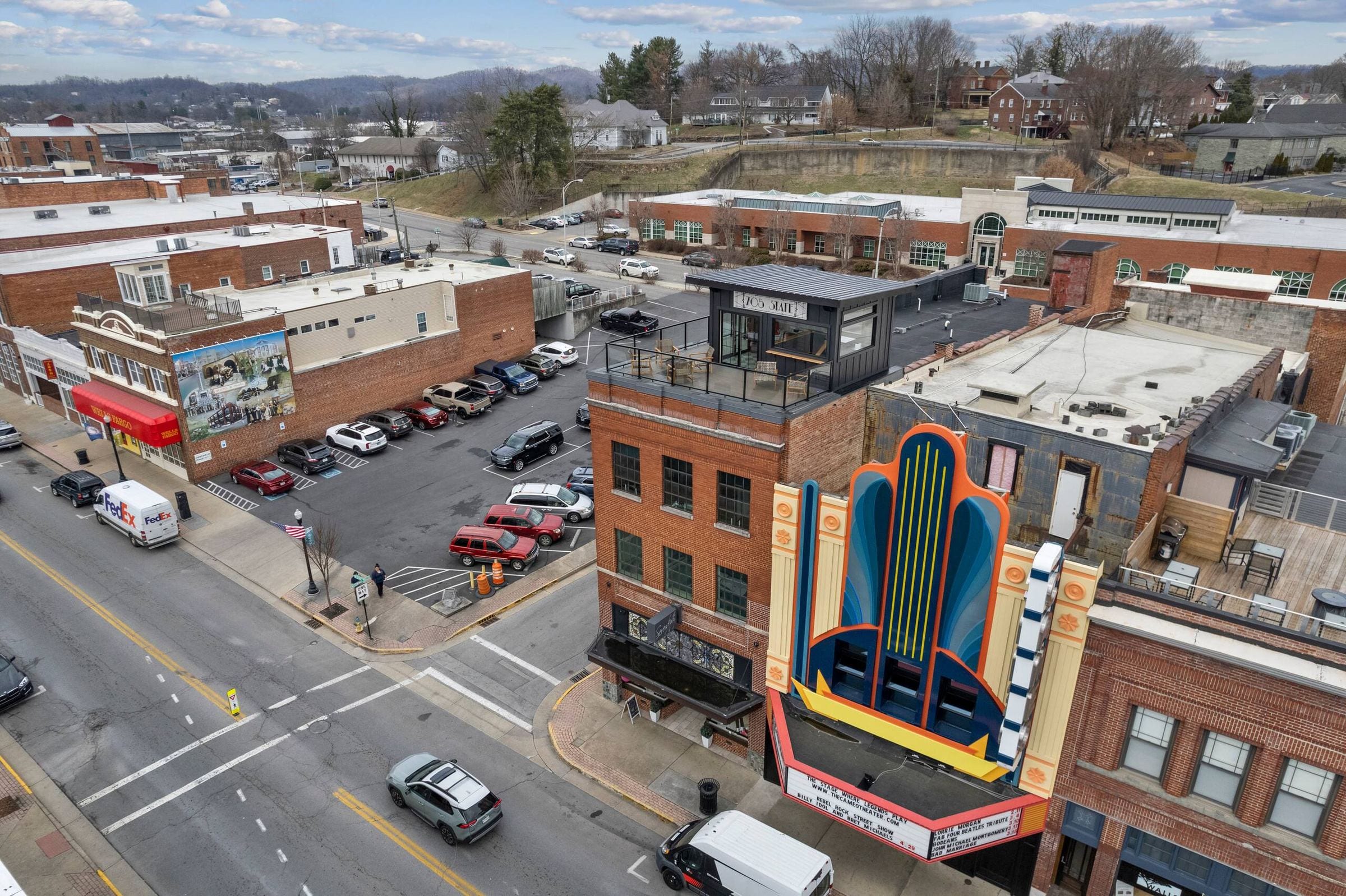 From above: the brick building with its rooftop deck and penthouse, and the Cameo Theater's marquee next door.