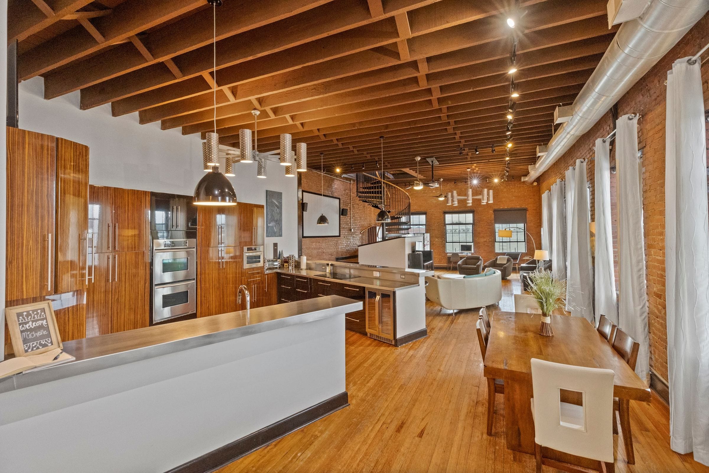 The kitchen: wood cabinets, stainless appliances and a long island.