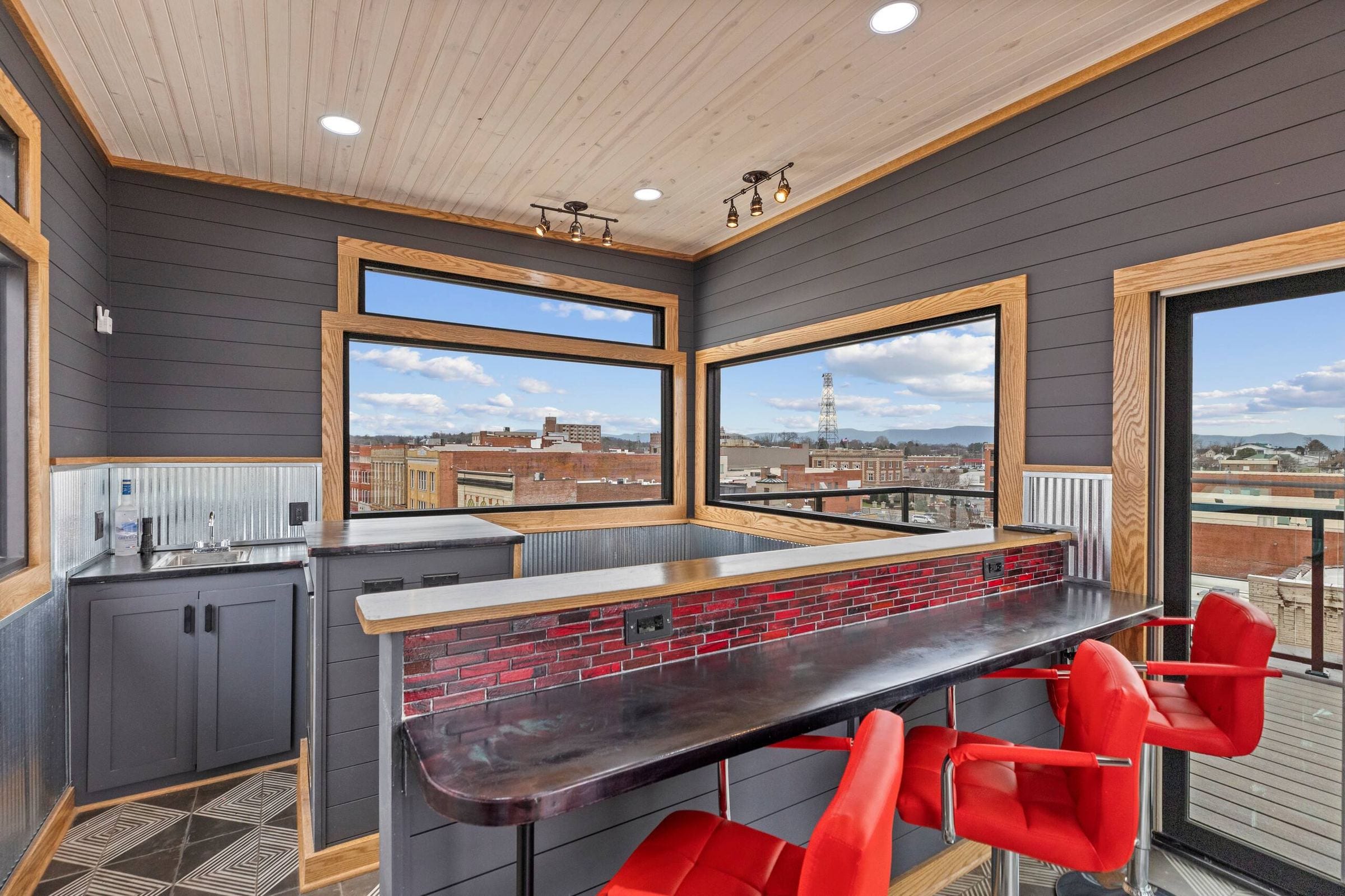 Another angle on the penthouse bar and its red stools.